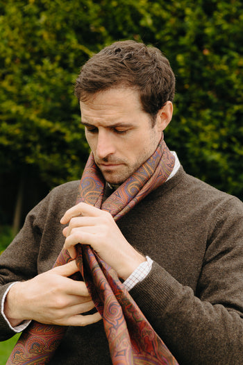 Model wears Autumn paisley silk scarf with  Budd knitted jumper