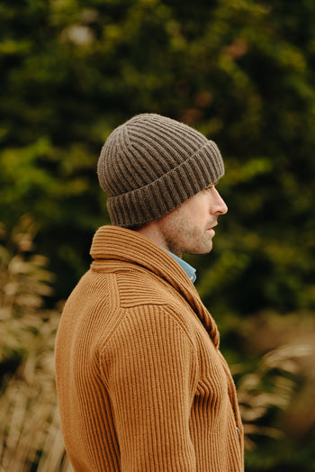 Model wearing knitted cashmere hat for menswear accessories