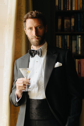 Black Tie Attire, Model wearing white pleated dress shirt and black bow tie