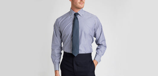 Close up of man wearing a Budd Stripe Blue Shirt and Tie