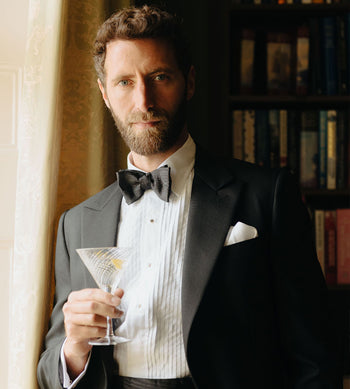 Black Tie Attire, Model wearing white pleated dress shirt and black bow tie