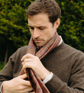 Model wears Autumn paisley silk scarf with  Budd knitted jumper