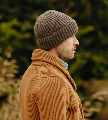 Model wearing knitted cashmere hat for menswear accessories